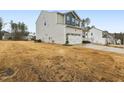 Charming two-story home with a welcoming front porch and a well-manicured lawn at 440 Pierce Landing Dr, Garner, NC 27529