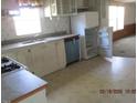 Functional kitchen with essential appliances, ample cabinet space, and natural light from the window at 65 Aunt Bibba Way, Youngsville, NC 27596