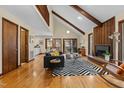 Spacious living area featuring a fireplace, stairs, and access to outdoor living at 864 Shadylawn Rd, Chapel Hill, NC 27514