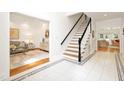 Welcoming foyer with staircase and views of the living room at 9700 Pentland Ct, Raleigh, NC 27614
