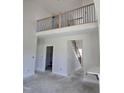 Unfinished interior featuring a natural wood and black rod iron stairway with a railing at 1039 N Lincoln St, Benson, NC 27504
