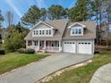 Inviting two-story home with a classic front porch and an attached two-car garage at 105 Byron Ct, Oxford, NC 27565