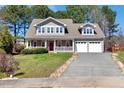 Beautiful two-story home with a cozy front porch and a convenient two-car garage at 105 Byron Ct, Oxford, NC 27565