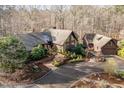 Stunning aerial view of a beautiful home with a circular driveway and lush landscaping at 10729 Trego Trl, Raleigh, NC 27614