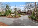 Charming home with mature trees and a circular driveway with a detached garage at 10729 Trego Trl, Raleigh, NC 27614