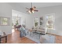 Bright, open-concept living area with hardwood floors and plenty of natural light at 109 Covington Square Dr, Cary, NC 27513