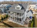 Beautiful home featuring a screened-in back porch, second-story deck and patio area at 110 Jacoby Way, Chapel Hill, NC 27516