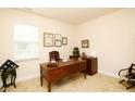 Traditional home office with wooden desk, chair, and natural light from window at 117 Oak Rise Ln, Fuquay Varina, NC 27526