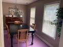 Traditional dining room with a piano, chandelier, and table with seating for six at 12 Patriot Cir, Durham, NC 27704