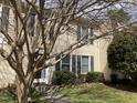 Charming townhouse with black shutters and lush, green lawn at 12 Patriot Cir, Durham, NC 27704