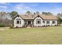 Classic brick home showcasing manicured landscaping and beautiful architectural details for an elegant first impression at 1512 Clark Farm Rd, Apex, NC 27502