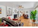 Inviting living room with fireplace, built-in shelving, and a cozy seating area at 1704 Cypress Dr, Henderson, NC 27536