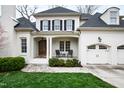 Charming white brick home with a front porch and two-car garage at 2635 Lakeview Dr, Raleigh, NC 27609