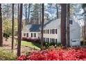 Beautiful two-story home with black shutters, colorful landscaping, and a well-maintained lawn at 3508 Cambridge Rd, Durham, NC 27707