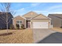 Inviting single-Gathering home features a spacious two-car garage and a stone and siding exterior at 358 E Painted Way Way, Clayton, NC 27527