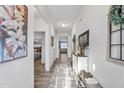 Bright hallway features stylish decor, leading to the bedroom and living room at 358 E Painted Way Way, Clayton, NC 27527
