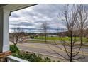 Neighborhood street view featuring a grassy area with a school in the background at 376 Granite Mill Blvd, Chapel Hill, NC 27516