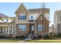Charming two-story home featuring a stone facade, neutral siding, and a well-manicured lawn at 4117 Bluff Oak Drive Dr, Cary, NC 27519