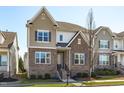 Charming two-story home featuring a stone facade, neutral siding, and a well-manicured lawn at 4117 Bluff Oak Drive Dr, Cary, NC 27519