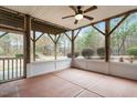 Cozy screened-in porch with a ceiling fan, offering an outdoor living space at 431 Heralds Way, Cary, NC 27519