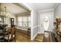 Elegant entryway with hardwood floors, crown molding, and stylish front door at 45 Wimberly Ave, Rocky Mount, NC 27804