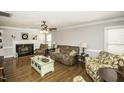 Cozy living room with a fireplace, hardwood floors, and comfortable seating area at 45 Wimberly Ave, Rocky Mount, NC 27804