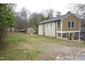 Expansive lot featuring a two-story home and a charming storage shed at 464 Longfellow St, Fuquay Varina, NC 27526