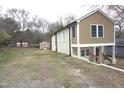 Spacious property featuring a two-story home and a convenient storage shed at 464 Longfellow St, Fuquay Varina, NC 27526