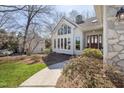 Stunning entryway with a large picture window and beautiful wood and glass front door at 8116 Windsor Ridge Dr, Raleigh, NC 27615
