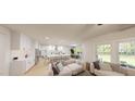 Open-concept living space flows seamlessly into a modern kitchen with a large center island and dining area at 8733 Maxine St # 37, Willow Springs, NC 27592