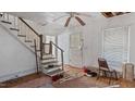 Foyer showing the stairs, walls, door, carpet, and ceiling of the house at 9056 Hicksboro Rd, Oxford, NC 27565