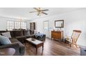 Bright living room with wood floors, cozy seating, and ample natural light at 918 Circle Dr, Angier, NC 27501