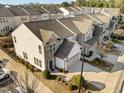 Aerial view of a townhome community with well-kept lawns and convenient parking at 1003 Mirbeck Ln, Durham, NC 27713