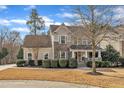 Charming two-story home with stone accents, manicured landscaping, and inviting curb appeal at 1416 Endgame Ct, Wake Forest, NC 27587