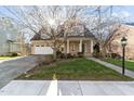 Lovely home with lush front lawn, mature landscaping and a convenient two-car garage at 1818 Buxton Way, Burlington, NC 27215