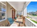 Relaxing front porch with comfortable seating, a welcoming entrance, and pleasant neighborhood views at 2015 Stanchion St, Haw River, NC 27258
