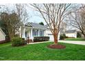 View of the well-maintained lawn and charming exterior at 2024 Heritage Pines Dr, Cary, NC 27519