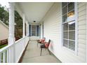 Covered front porch with chairs perfect for relaxing at 2024 Heritage Pines Dr, Cary, NC 27519