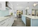 Well-lit kitchen featuring a center island, stainless steel appliances, and ample counter space at 2046 Fellini Dr, Apex, NC 27502