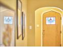 Foyer featuring an arched doorway and decorative window in the front door at 2313 Prince St, Durham, NC 27707