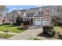 Charming two-story home with a two-car garage, landscaped yard, and inviting curb appeal at 233 Candia Ln, Cary, NC 27519