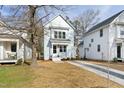 Light blue two-story home with inviting front lawn and drive at 2816 Cascadilla St, Durham, NC 27704
