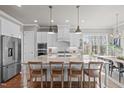 Bright, open kitchen featuring a large island, stainless steel appliances, and modern finishes at 2826 Walden Rd, Apex, NC 27502
