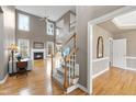 Spacious living room with high ceilings, fireplace, hardwood floors, and natural light at 3312 Clandon Park Dr, Raleigh, NC 27613