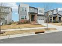 Charming two-story home with an attached garage, a welcoming porch and landscaped front yard at 4513 Bridle Run Dr, Raleigh, NC 27606