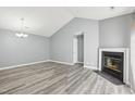 Inviting living room with a fireplace and modern gray flooring at 509 High Ridge Dr, Durham, NC 27707