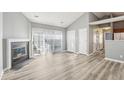 Spacious living area featuring a fireplace, sliding glass door to a patio, and neutral color palette at 509 High Ridge Dr, Durham, NC 27707