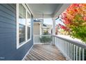 Spacious front porch featuring a wooden deck with views of the neighborhood at 52 N Rosebank Dr, Chapel Hill, NC 27516