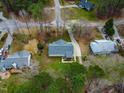 Aerial perspective of a cozy home nestled among trees in a quiet neighborhood at 5216 Passenger Pl, Raleigh, NC 27603