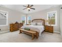 Spacious main bedroom with three windows, neutral paint, and a king bed at 562 Boulder Point Dr, Chapel Hill, NC 27516